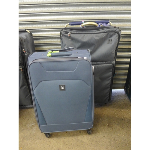 2310 - Six assorted suitcases