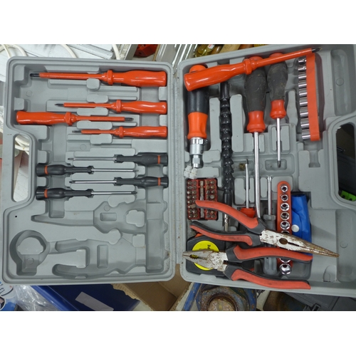 2021 - A toolbox with tools including screwdrivers, hammers, wrench, etc.