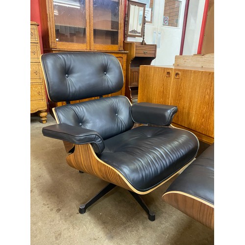 4 - A Charles & Ray Eames style simulated rosewood and black leather revolving lounge chair and ottoman