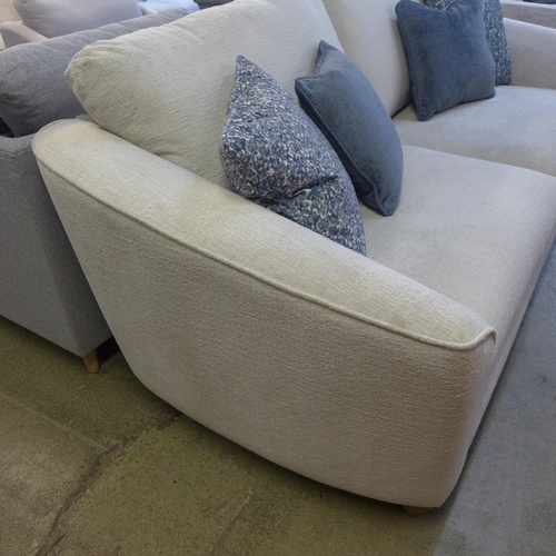 1321 - An ivory velvet three seater sofa with contrasting scatter cushions