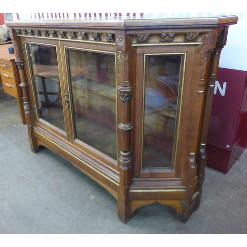 84 - A Victorian Gothic Revival inlaid walnut, burr walnut and parcel gilt two door side cabinet, attribu... 