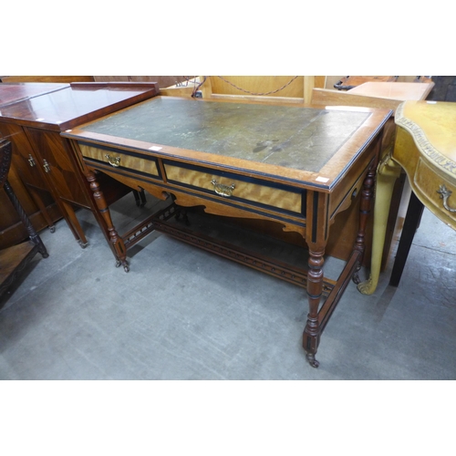 138 - A Victorian Aesthetic Movement walnut and green leather topped two drawer writing table