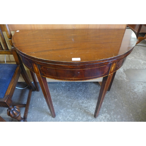 160 - A George III inlaid mahogany demi lune fold over tea table