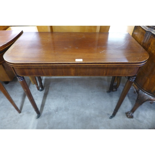 164 - A George IV inlaid mahogany D-shaped fold over tea table