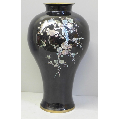 601 - A Chinese enamelled vase with mother of pearl detail, 31cm