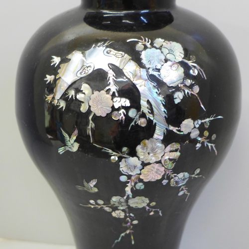 601 - A Chinese enamelled vase with mother of pearl detail, 31cm