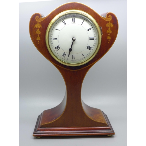 603 - An Edwardian stylised balloon clock with inlaid case, 25cm