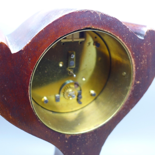 603 - An Edwardian stylised balloon clock with inlaid case, 25cm