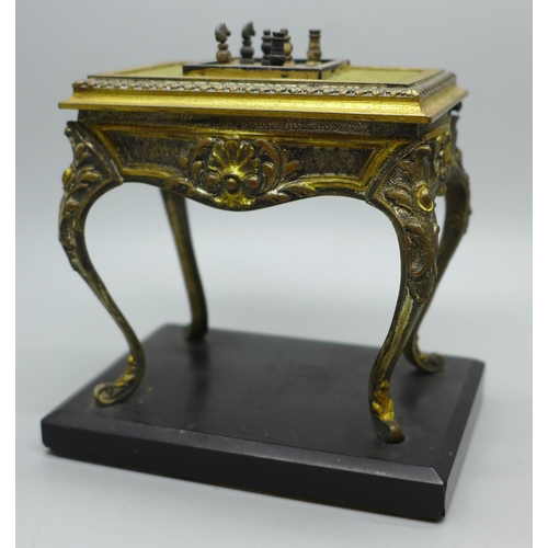 607 - A cast metal table vesta in the form of French Louis XI style table with chessboard and chess pieces... 