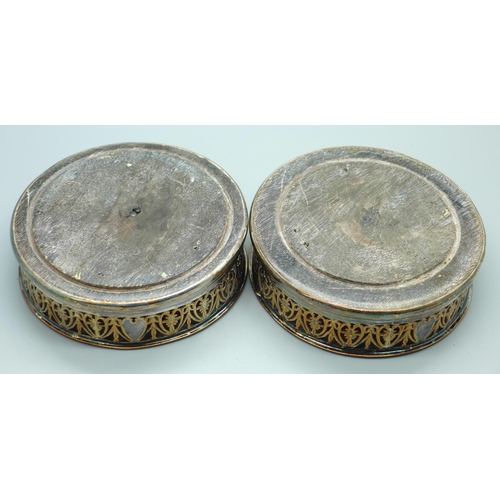 625 - Two Georgian silver plate on copper wine coasters