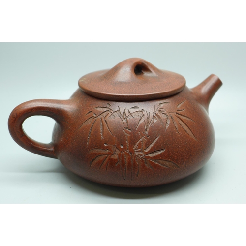 630 - A Chinese terracotta tea pot