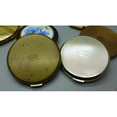 635 - Nine compacts including Stratton and Kigu, and a handbag mirror