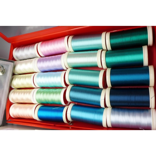 649 - A collection of 57 multi-coloured reels of hobbyist embroidery thread and a set of novelty top hat p... 