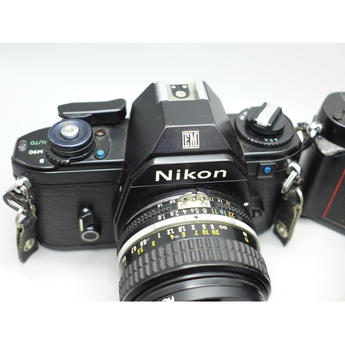 651 - Two Nikon cameras, EM and F3