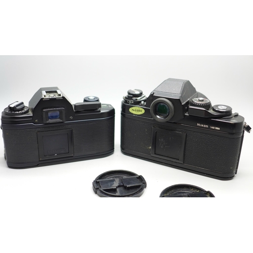 651 - Two Nikon cameras, EM and F3