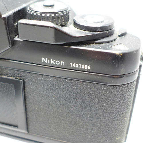 651 - Two Nikon cameras, EM and F3