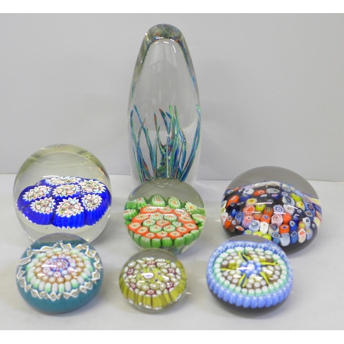 658 - Seven glass paperweights