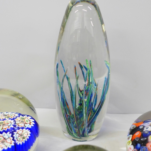 658 - Seven glass paperweights