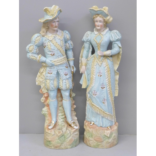 670 - A pair of German bisque figures, hat on gentleman a/f, chipped