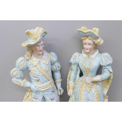 670 - A pair of German bisque figures, hat on gentleman a/f, chipped