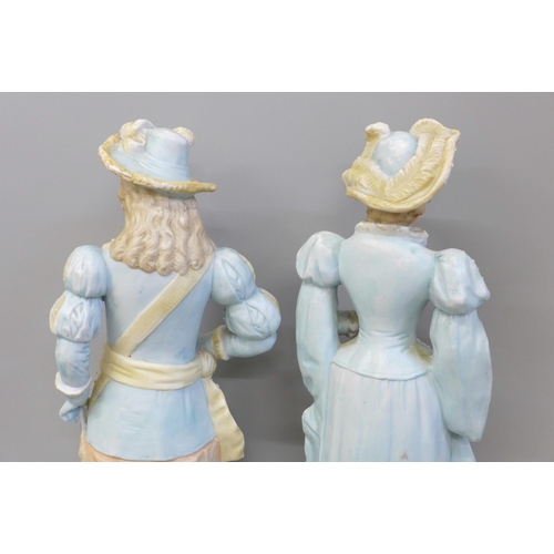 670 - A pair of German bisque figures, hat on gentleman a/f, chipped