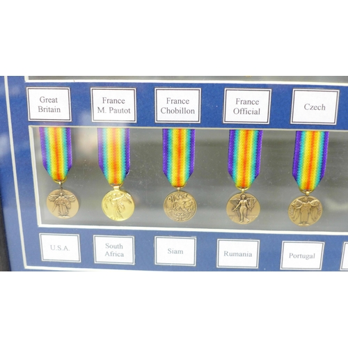 672 - A framed collection of WWI miniature medals