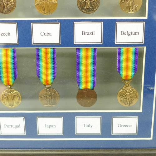 672 - A framed collection of WWI miniature medals