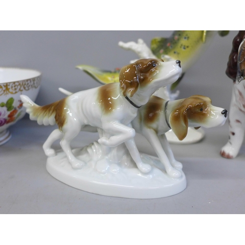 673 - A continental China bowl, a Goebel brook trout figure, a/f, (fin re-glued), and two dog figures