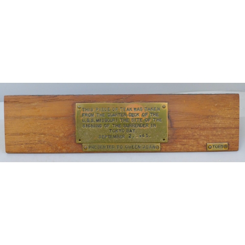 676 - A piece of teak, taken from the Quarter-Deck of the USS Missouri, the site of the signing of the sur... 