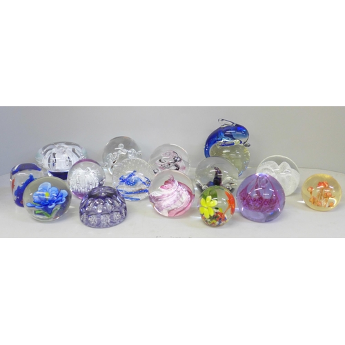 679 - Fourteen glass paperweights including Caithness and Selkirk, and one other paperweight