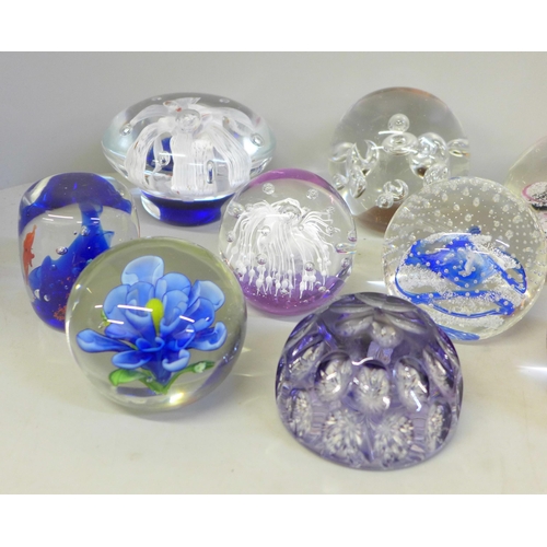 679 - Fourteen glass paperweights including Caithness and Selkirk, and one other paperweight