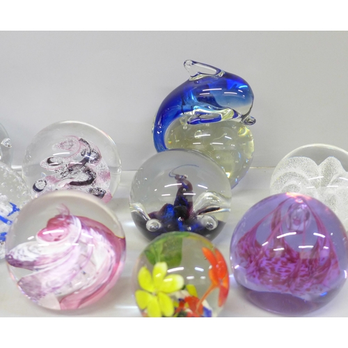 679 - Fourteen glass paperweights including Caithness and Selkirk, and one other paperweight