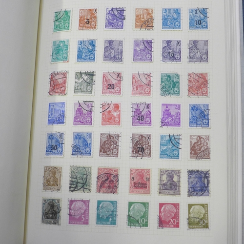 692 - Stamps; four albums of stamps