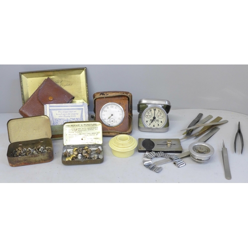 693 - Watchmaker's tweezers, movement holders, travel clock, etc.