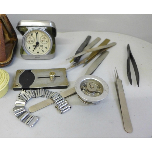 693 - Watchmaker's tweezers, movement holders, travel clock, etc.