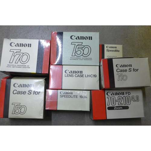 728 - Two Canon cameras; T50 and T70, a collection of accessories including a 70-210 zoom lens, a 244T Spe... 