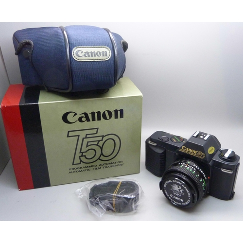 728 - Two Canon cameras; T50 and T70, a collection of accessories including a 70-210 zoom lens, a 244T Spe... 