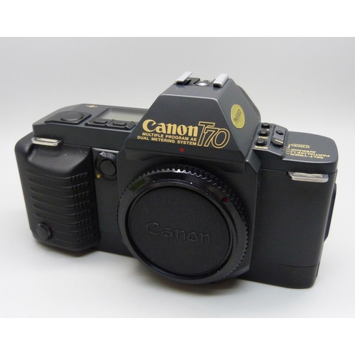 728 - Two Canon cameras; T50 and T70, a collection of accessories including a 70-210 zoom lens, a 244T Spe... 