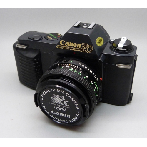 728 - Two Canon cameras; T50 and T70, a collection of accessories including a 70-210 zoom lens, a 244T Spe... 