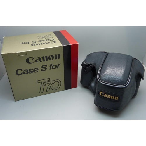 728 - Two Canon cameras; T50 and T70, a collection of accessories including a 70-210 zoom lens, a 244T Spe... 