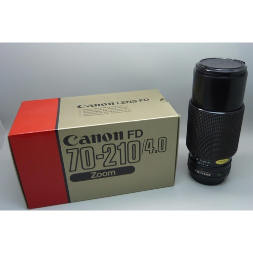 728 - Two Canon cameras; T50 and T70, a collection of accessories including a 70-210 zoom lens, a 244T Spe... 