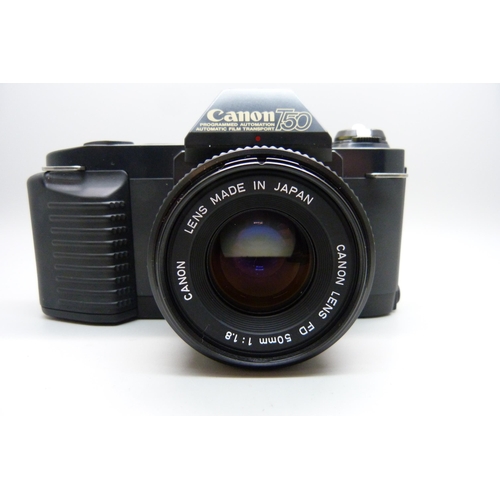 728 - Two Canon cameras; T50 and T70, a collection of accessories including a 70-210 zoom lens, a 244T Spe... 