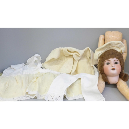 732 - A circa 1900 French doll, marked SBFJ, Paris, fixed eyes, a/f including a crack on the face