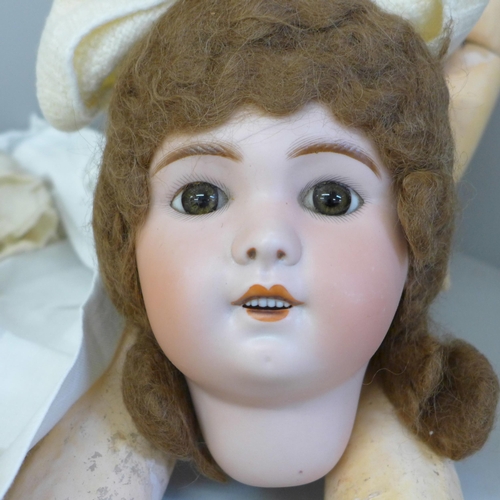 732 - A circa 1900 French doll, marked SBFJ, Paris, fixed eyes, a/f including a crack on the face