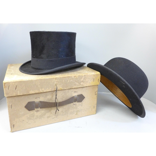 741 - A W.H. Robeson bowler hat and a G.A. Dunn & Co. top hat, (top hat opening 155mm wide x 195mm)