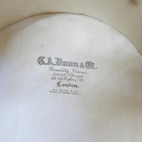 741 - A W.H. Robeson bowler hat and a G.A. Dunn & Co. top hat, (top hat opening 155mm wide x 195mm)