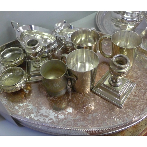 785 - Three George V silver plate half-pint mugs, a pair of silver plated candlesticks, a gallery tray, a ... 