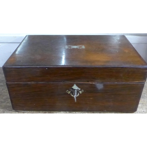 789 - A wooden box with mother of pearl inlay, two lighters, metalware and a safety razor