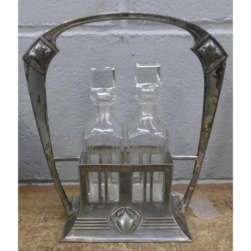 808 - An Art Nouveau two bottle oil and vinegar cruet, electroplated base stamped no. 444/2 with WMF logo ... 