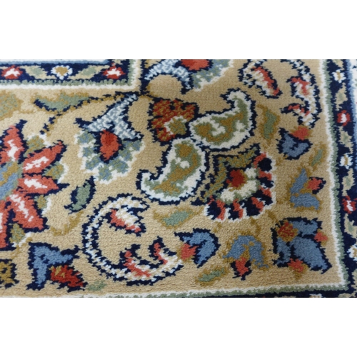 1496 - A cream ground multi-coloured field, full pile carpet, 300xm x 200cm